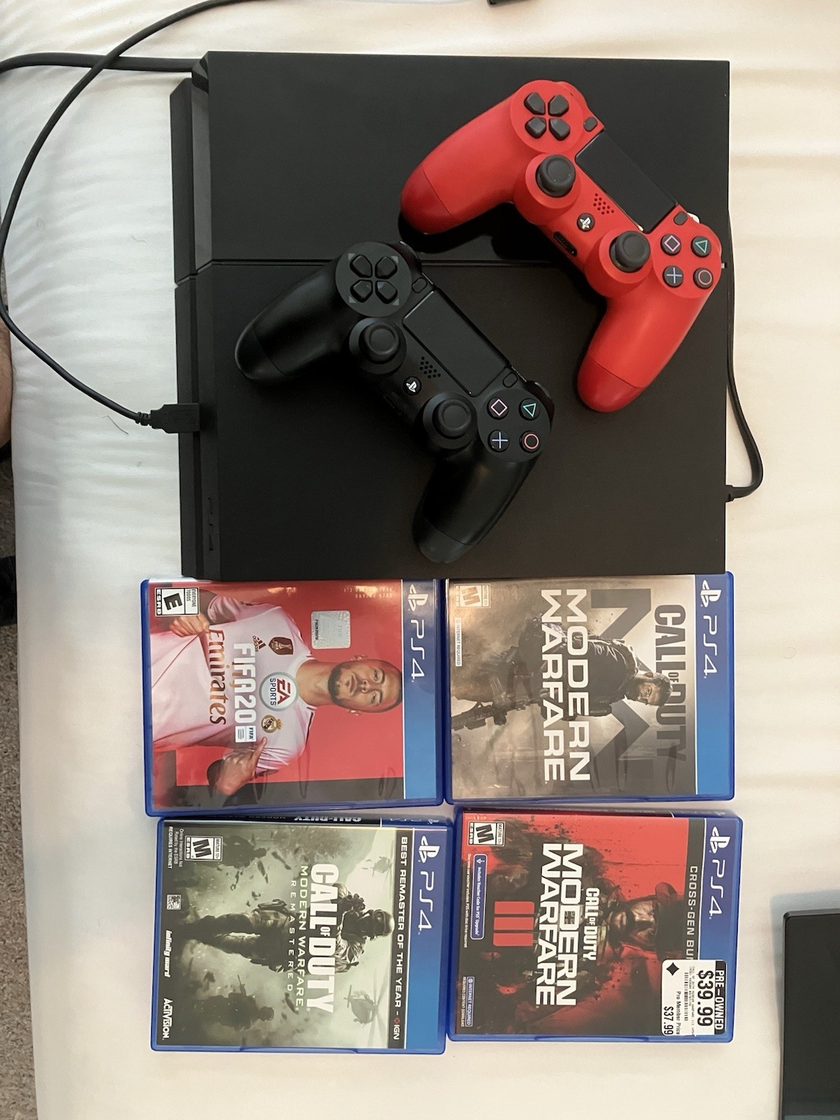 Sony PlayStation 4 500gb Jet Black Console With Two Controllers and 4 Games